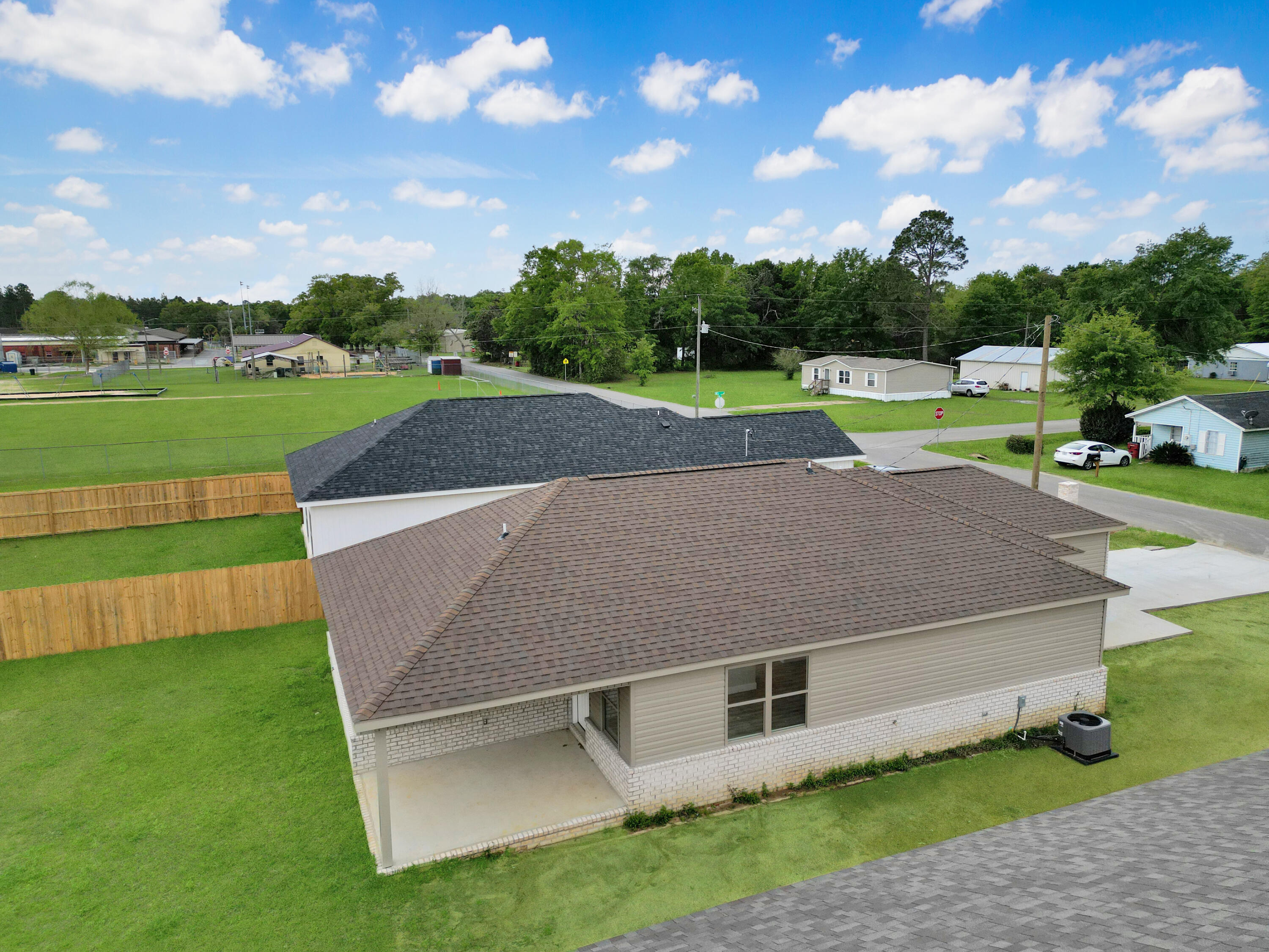 5771 Monroe Street Baker, FL 32531 - Photo 4 of 23 a aerial view of a house with a yard