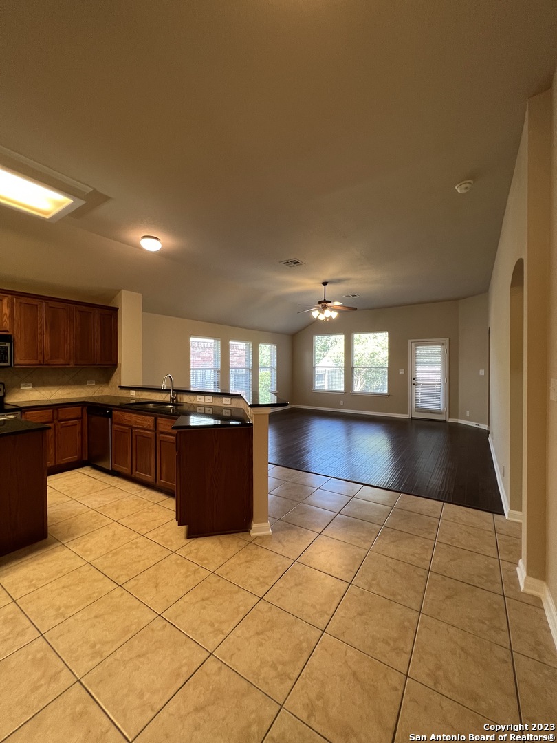 24431 Flint Creek San Antonio, TX 78255 - Photo 14 of 45 a kitchen with a sink and cabinets