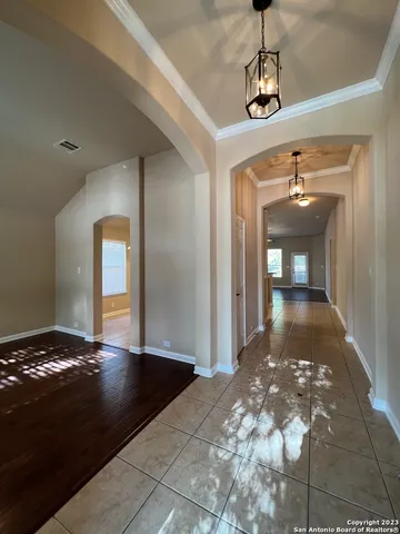 a view of a hallway with a chandelier
