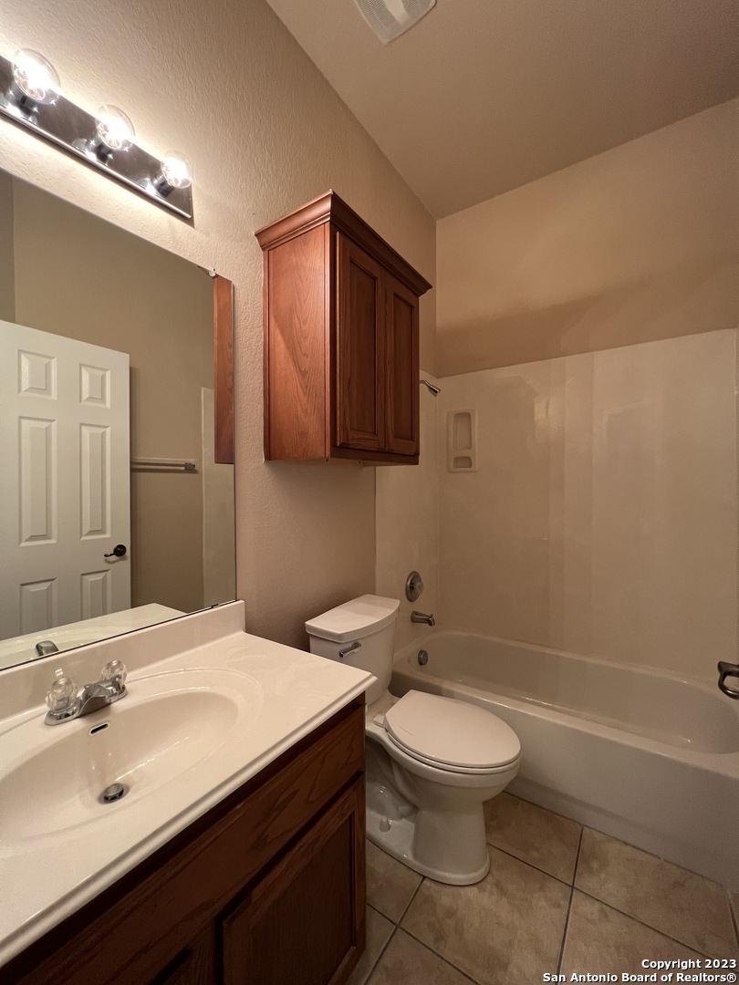 24431 Flint Creek San Antonio, TX 78255 - Photo 25 of 45 a bathroom with a sink a toilet and shower