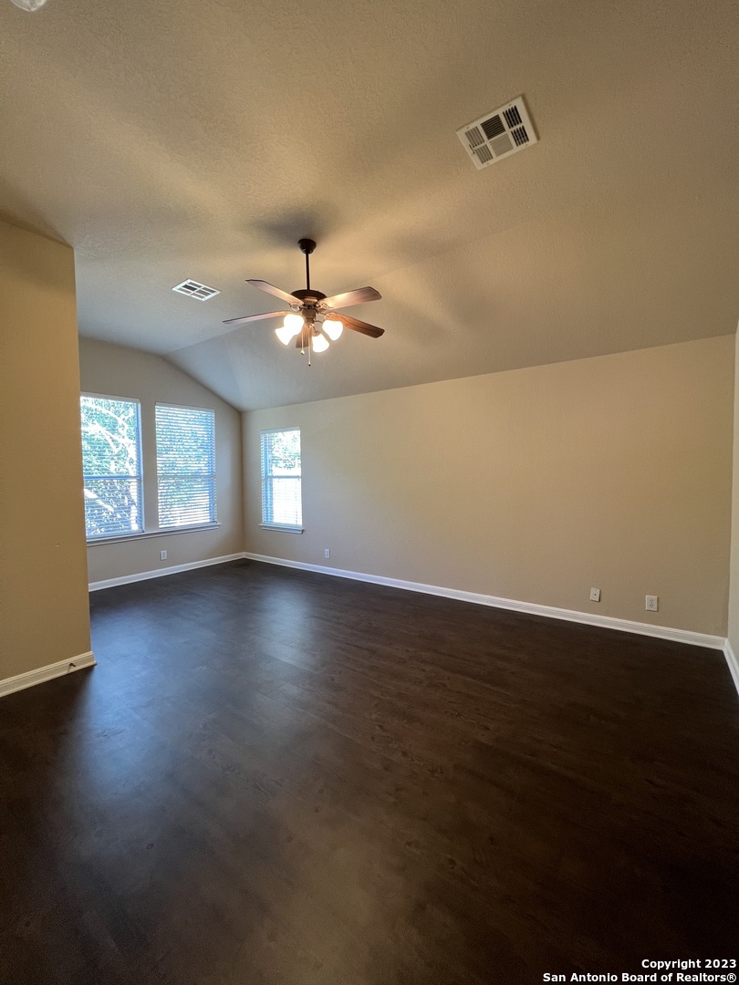 24431 Flint Creek San Antonio, TX 78255 - Photo 35 of 45 a view of an empty room with wooden floor and a window