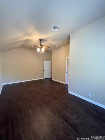 a view of a room with wooden floor