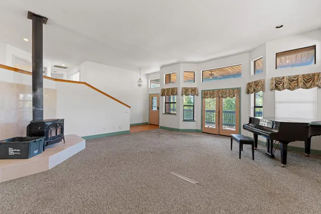 a large kitchen with stainless steel appliances granite countertop a large counter top and a stove