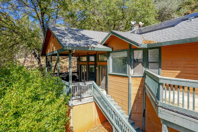 an aerial view of a house with swimming pool