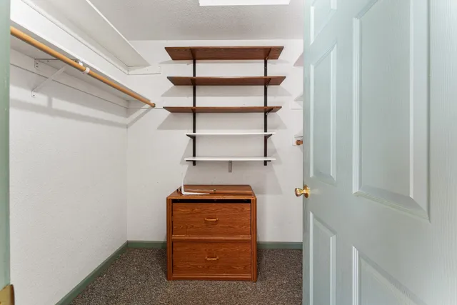 a bathroom with a shower sink and mirror