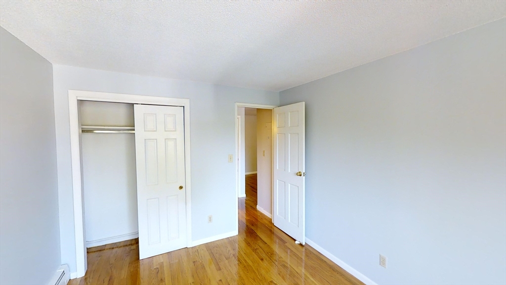 14 Murdock Street, Unit 17 Somerville, MA 02145 - Photo 7 of 12 a view of wooden floor in an empty room