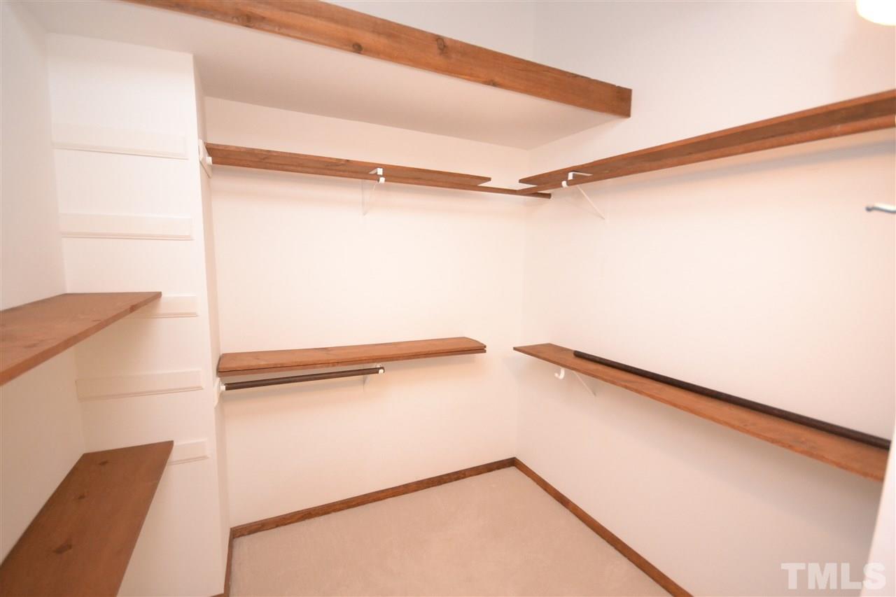 2400 Windsor Trail Raleigh, NC 27615 - Photo 11 of 19 a view of walk in closet with empty racks