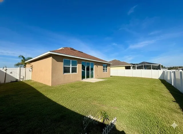 a house view with swimming pool in front of it