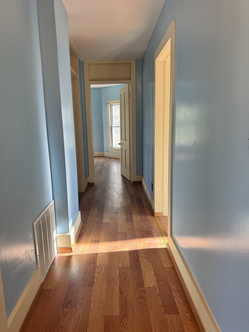 410 3rd Street Mendota, IL 61342 - Photo 11 of 18 a view of a room with wooden floor and staircase