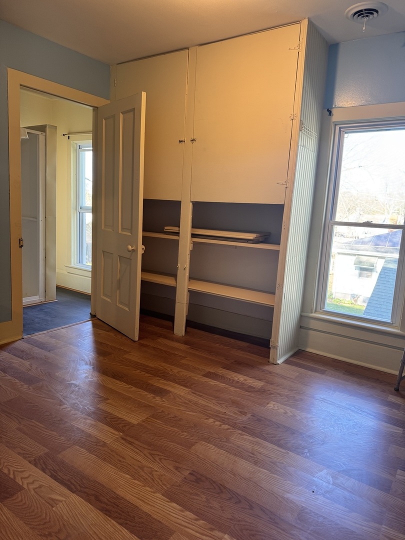 410 3rd Street Mendota, IL 61342 - Photo 12 of 18 a view of room with wooden floor and window