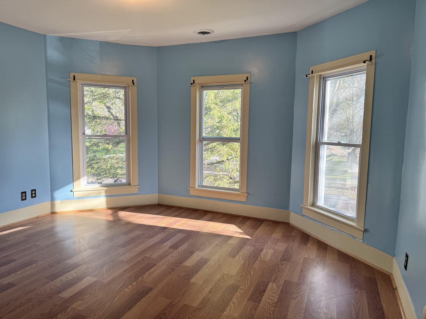410 3rd Street Mendota, IL 61342 - Photo 14 of 18 a view of an empty room with wooden floor and a window
