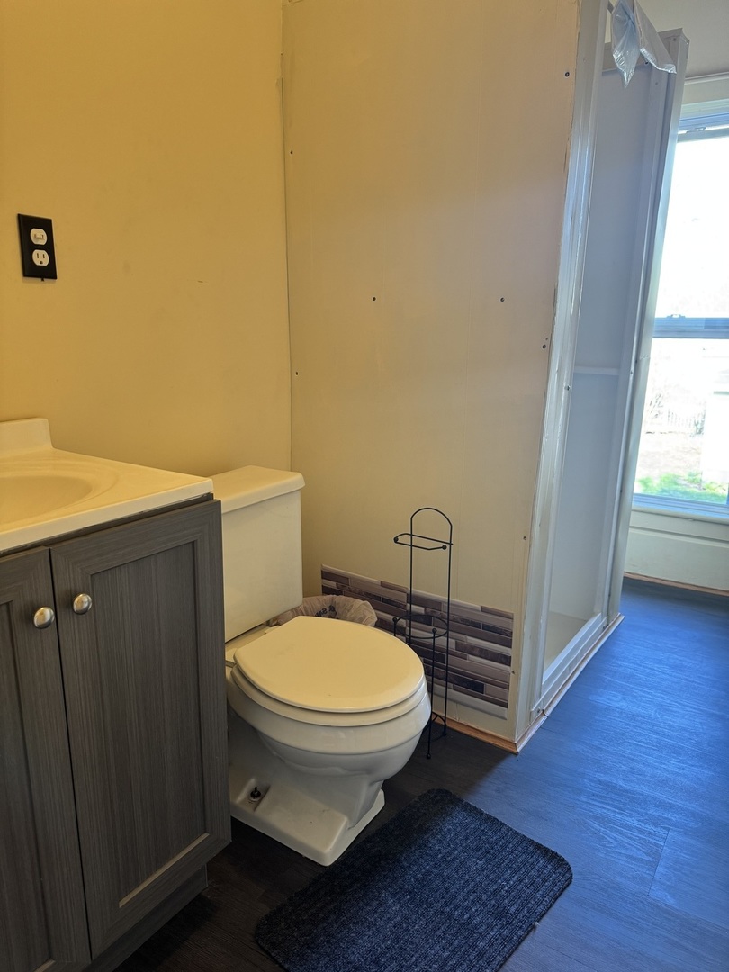 410 3rd Street Mendota, IL 61342 - Photo 15 of 18 a bathroom with a toilet and a sink