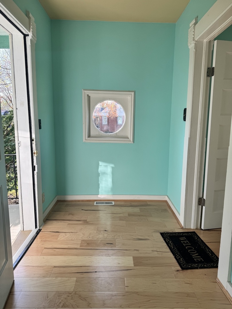 410 3rd Street Mendota, IL 61342 - Photo 2 of 18 a view of an empty room with a window