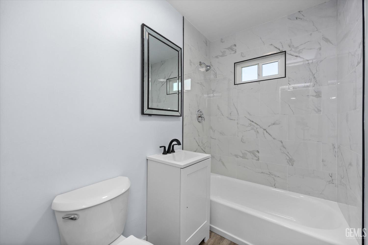 Undisclosed Address Bakersfield, CA 93306 - Photo 16 of 29 a bathroom with a sink mirror toilet and bathtub