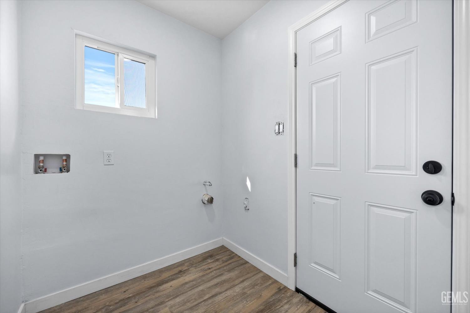 Undisclosed Address Bakersfield, CA 93306 - Photo 23 of 29 a view of a hallway with wooden floor