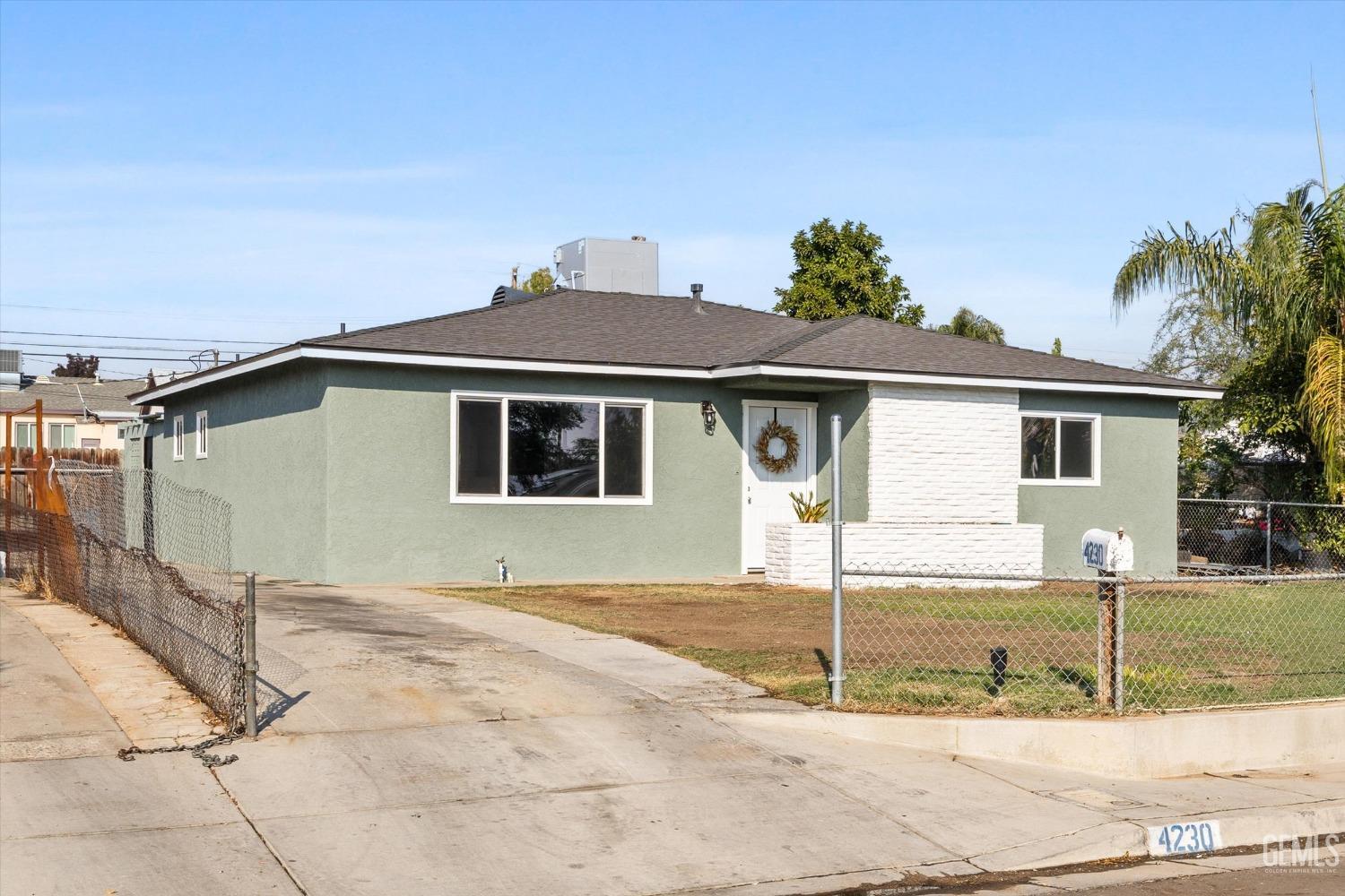 Undisclosed Address Bakersfield, CA 93306 - Photo 4 of 29 a front view of a house with a porch