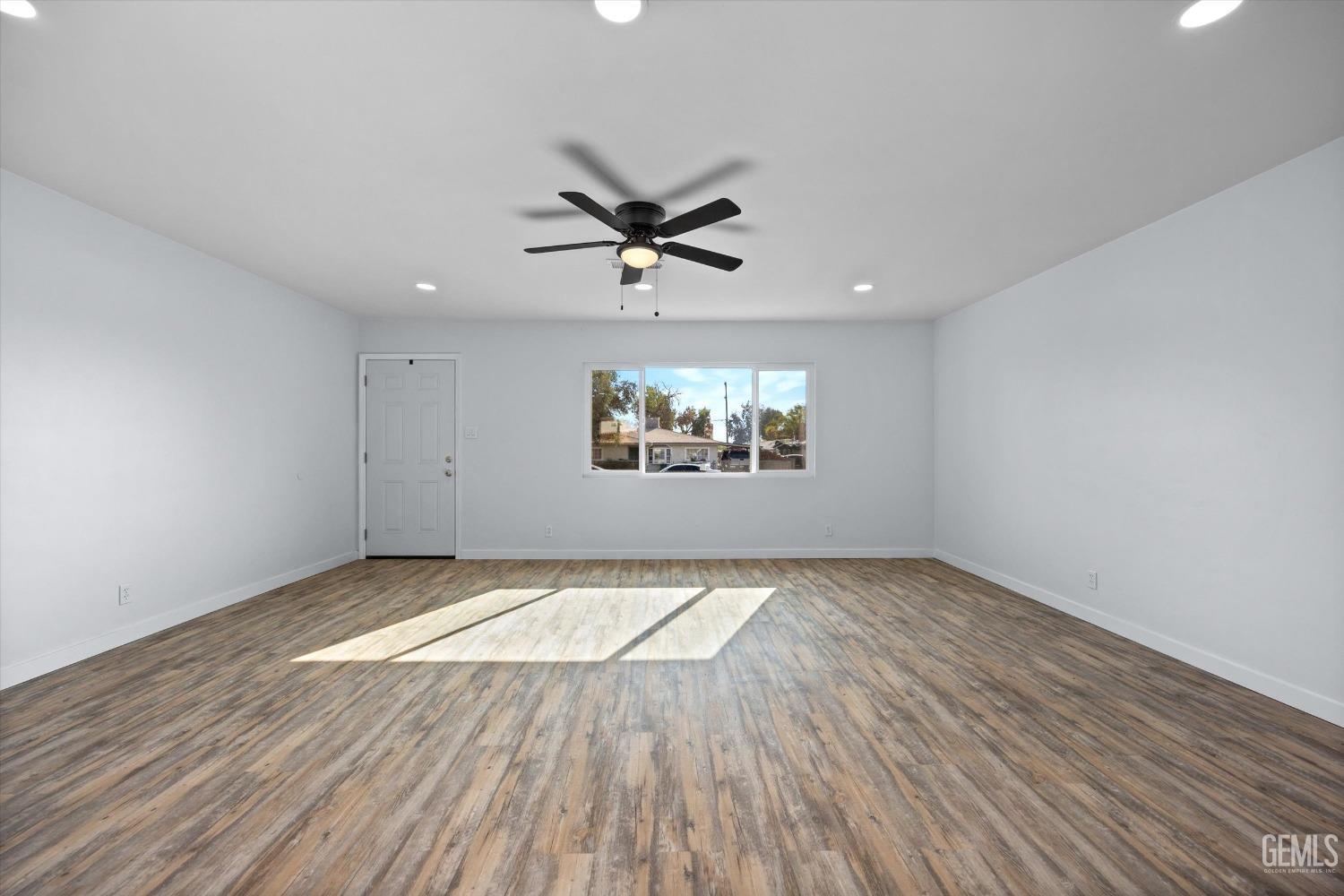 Undisclosed Address Bakersfield, CA 93306 - Photo 10 of 29 wooden floor in an empty room with a window