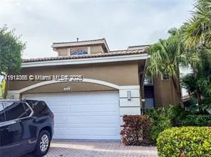 a front view of a house with parking space