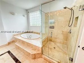a bathroom with a sink and a shower