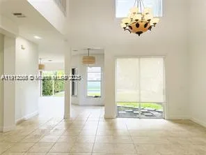 an empty room with a empty space and a window