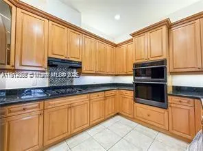 a bedroom with a bed and a ceiling fan