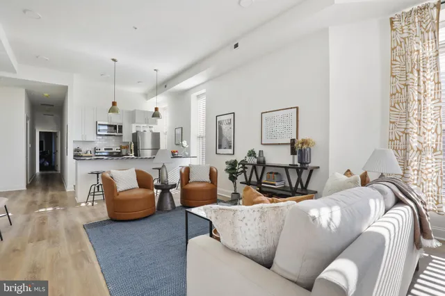 a view of a room with a table and chairs in a patio