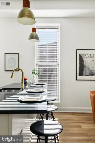 a kitchen with sink stove and cabinets