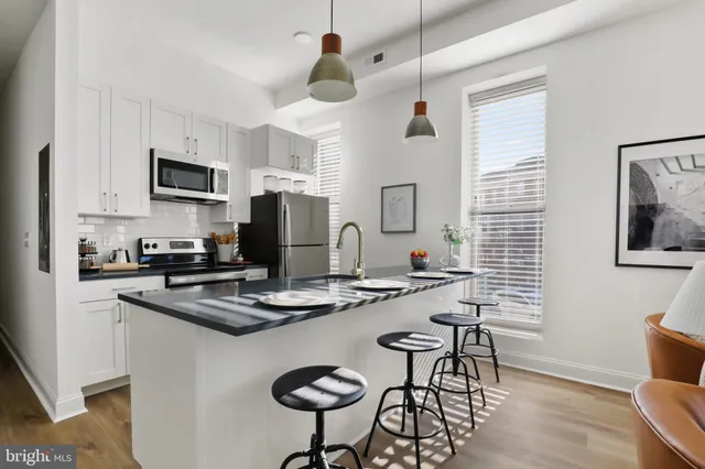 a bedroom with a bed and a couch