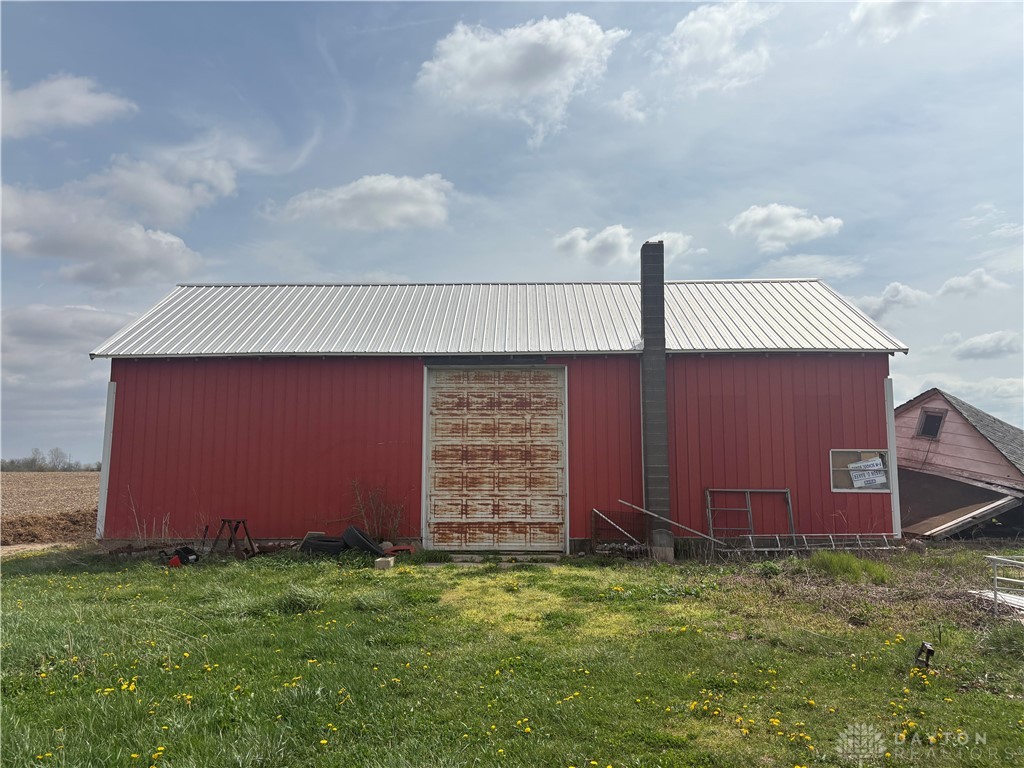 9006 Oakes Road Arcanum, OH 45304 - Photo 12 of 29 This expansive red barn offers vast possibilities for storage or agricultural pursuits.