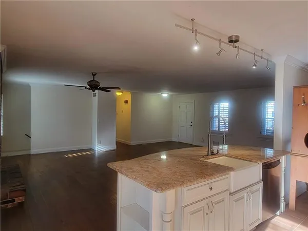 a view of a chair and table on the wooden floor