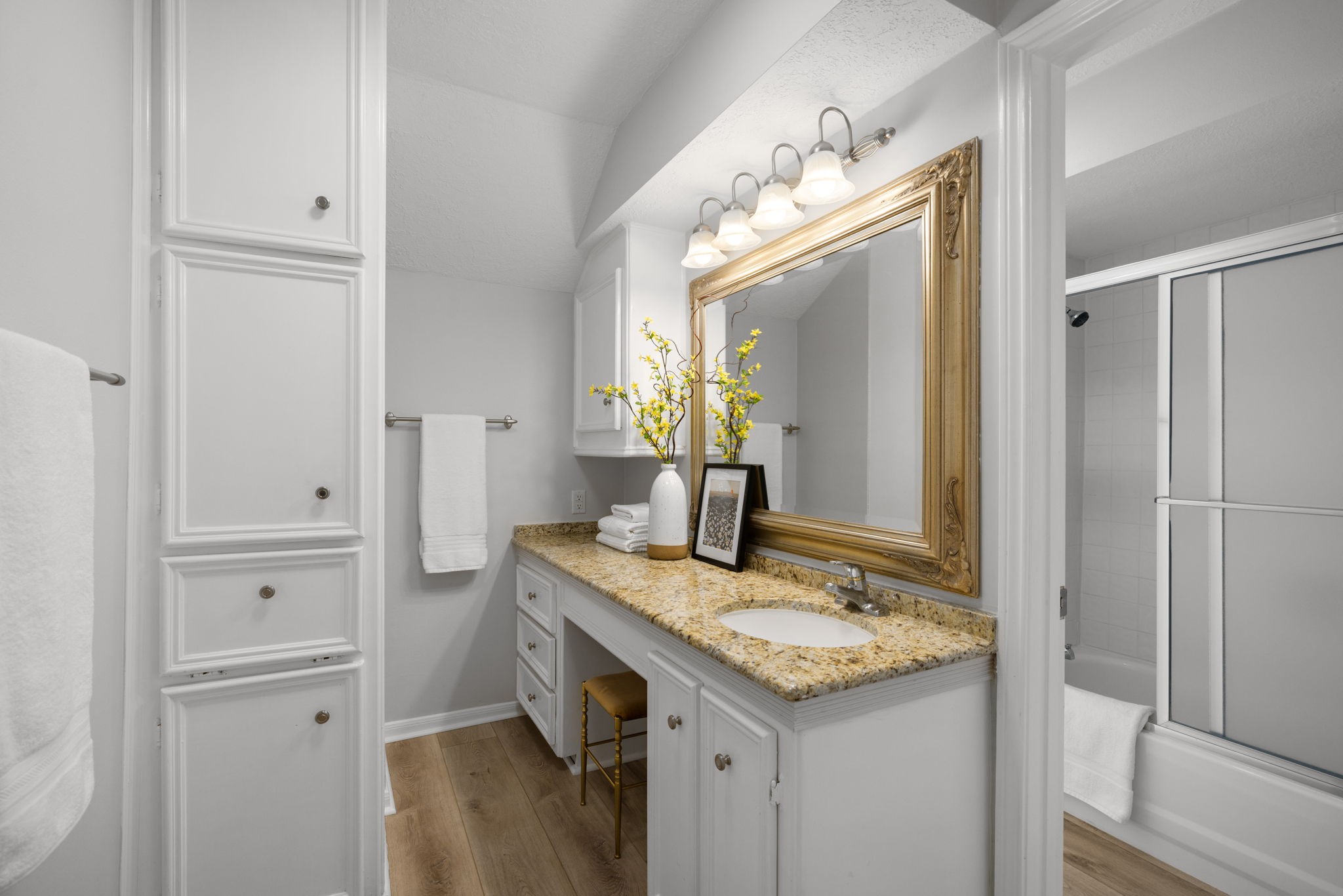 9203 Godstone Lane Spring, TX 77379 - Photo 29 of 49 The private bathroom is complete with a granite counter, large mirror, abundant storage and a private WC with combination tun and shower.