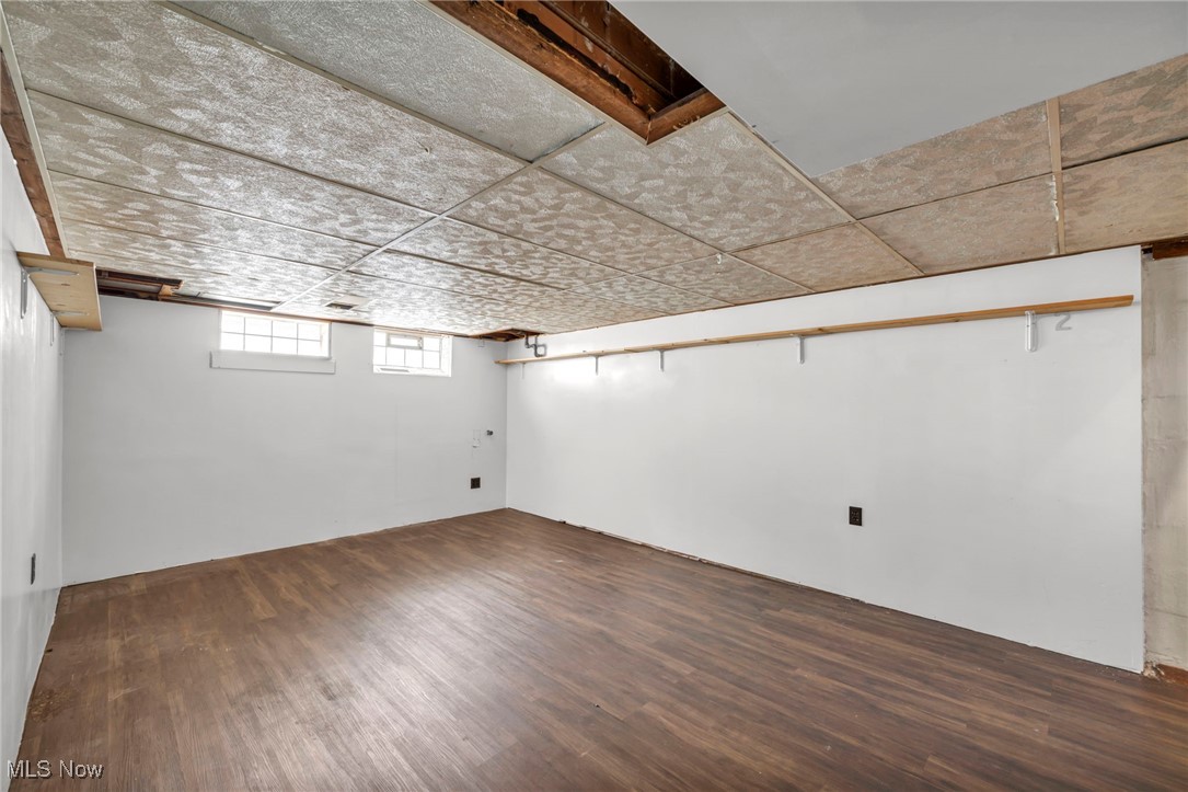 7822 Ridgefield Avenue Parma, OH 44129 - Photo 20 of 42 Basement featuring dark wood-type flooring and a drop ceiling