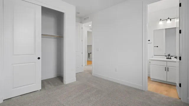 a view of a bathroom with sink mirror and shower