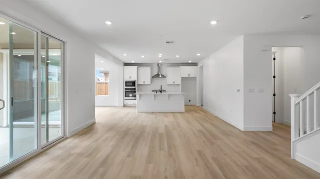 a view of kitchen with wooden floor