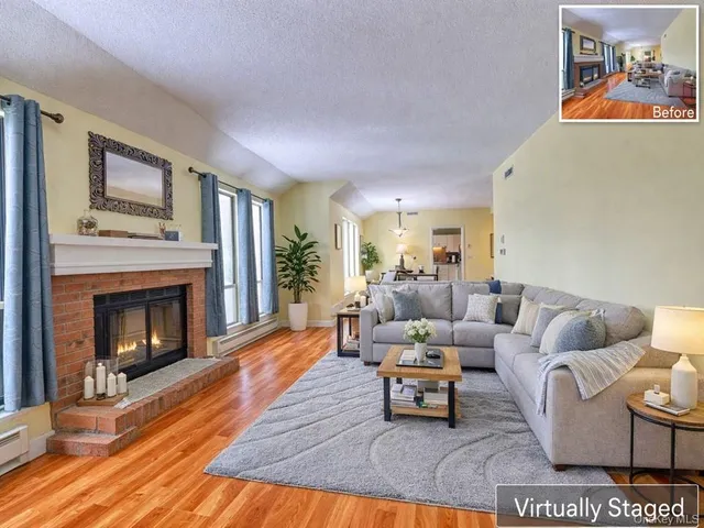 a living room with furniture and a fireplace