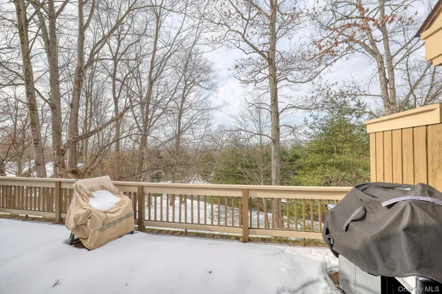 a view of a chair and tables in the balcony