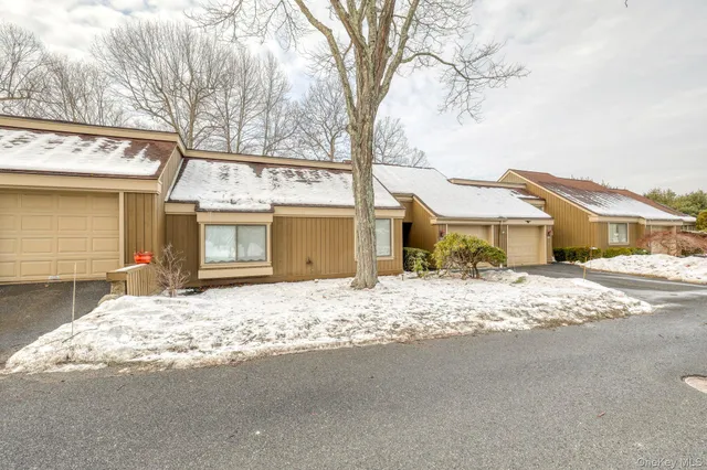 a front view of a house with a road and a stove