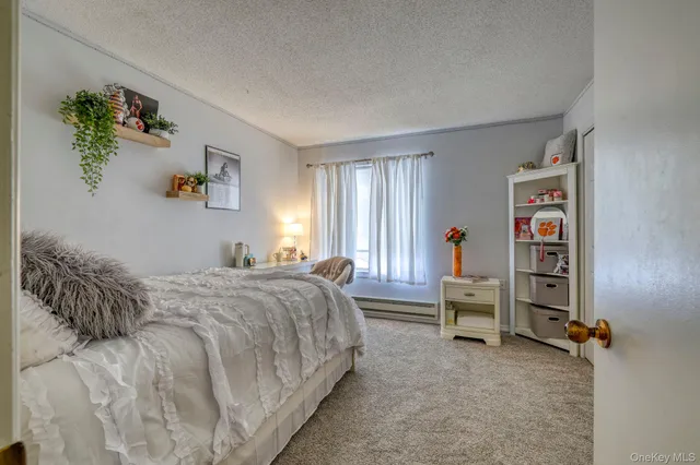 a bedroom with a bed and a book shelf