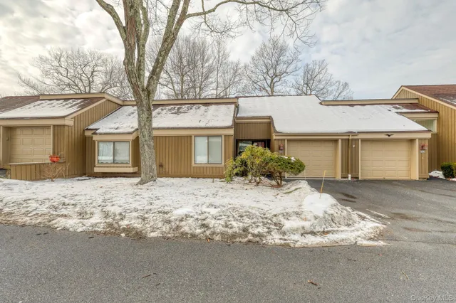 a front view of a house with a trees
