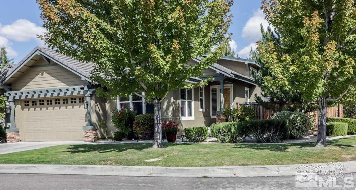 5001 Fall Colors Court Reno, NV 89519 - Photo 1 of 36 a front view of a house with a garden and tree