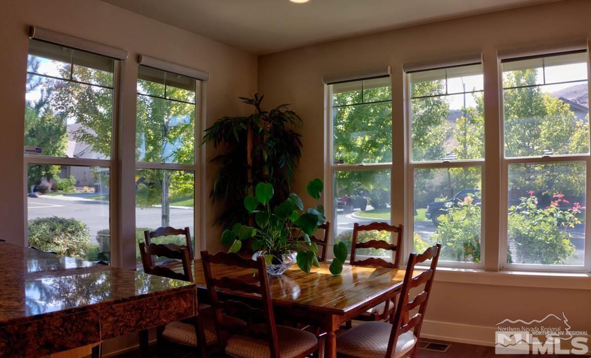 5001 Fall Colors Court Reno, NV 89519 - Photo 11 of 36 a view of a dining room with furniture window and outside view