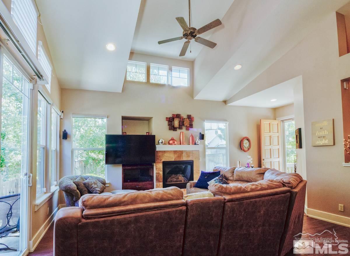 5001 Fall Colors Court Reno, NV 89519 - Photo 12 of 36 a living room with fireplace furniture and a large window