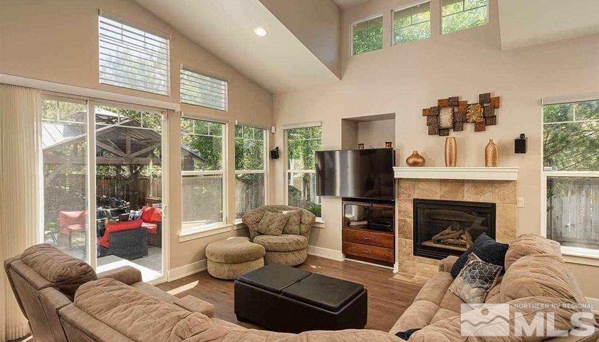 5001 Fall Colors Court Reno, NV 89519 - Photo 18 of 36 a living room with furniture a fireplace and a large window