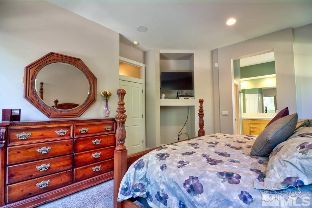 5001 Fall Colors Court Reno, NV 89519 - Photo 21 of 36 a bedroom with a bed and a dresser