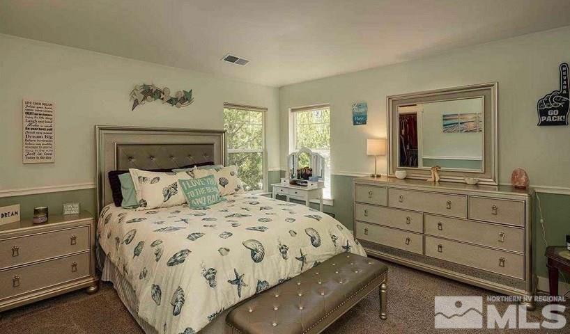 5001 Fall Colors Court Reno, NV 89519 - Photo 27 of 36 a bedroom with a bed and a dresser