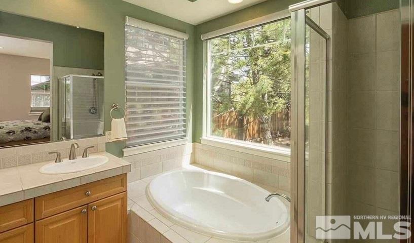 5001 Fall Colors Court Reno, NV 89519 - Photo 28 of 36 a bathroom with a sink and a mirror