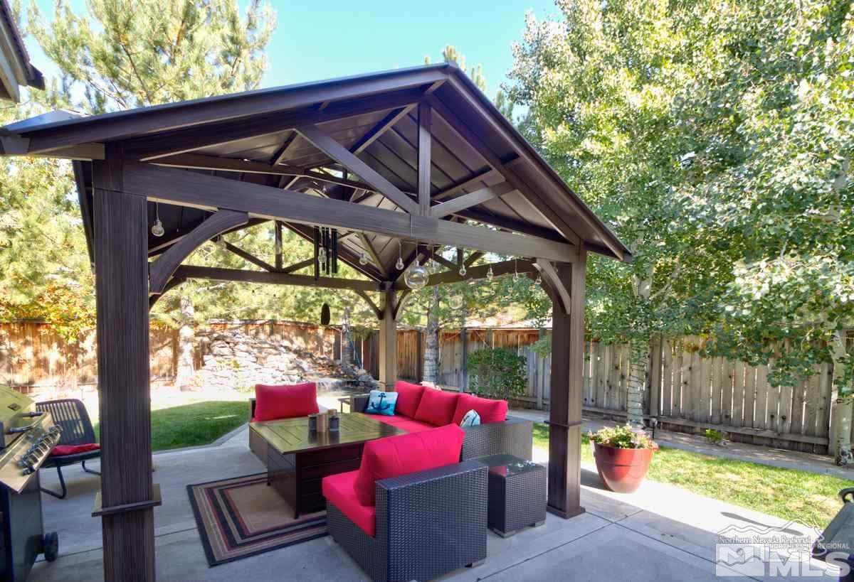 5001 Fall Colors Court Reno, NV 89519 - Photo 29 of 36 a view of a deck with wooden chairs and a yard