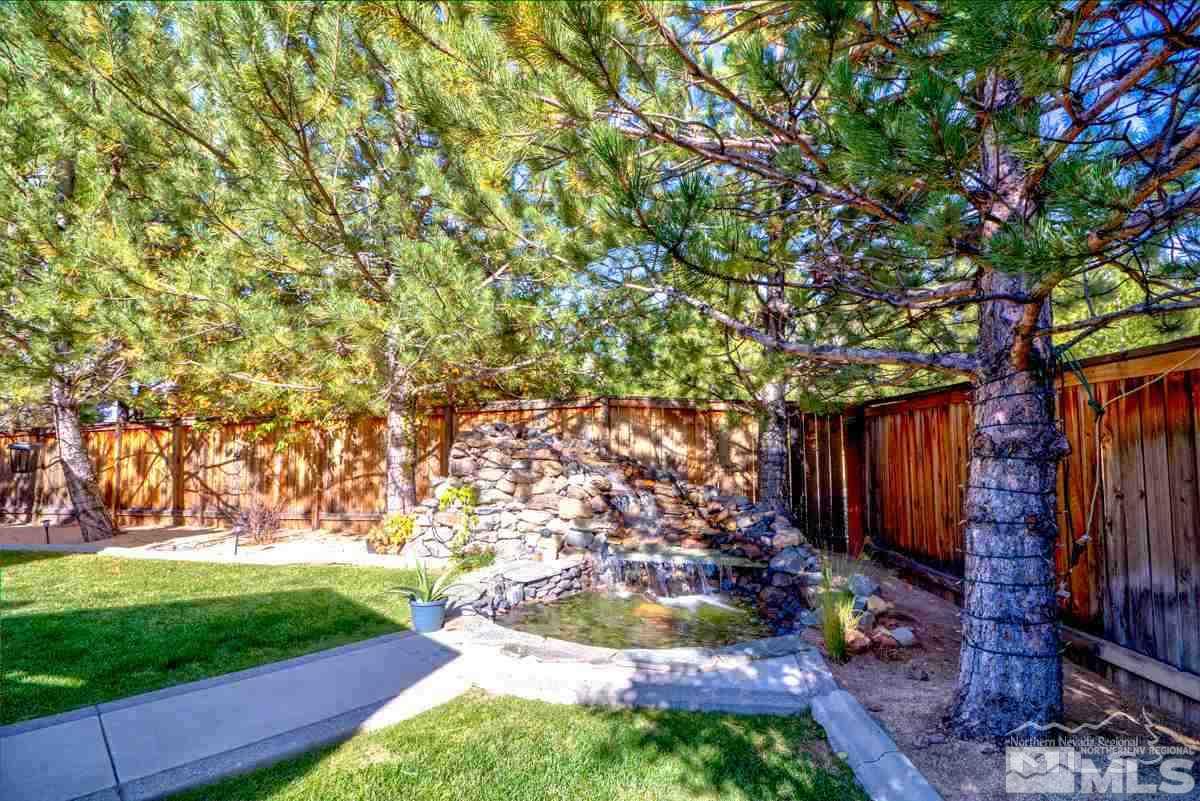 5001 Fall Colors Court Reno, NV 89519 - Photo 32 of 36 a backyard of a house with yard and outdoor seating