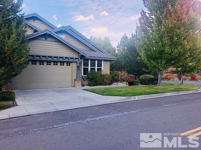 5001 Fall Colors Court Reno, NV 89519 - Photo 4 of 36 a front view of a house with a yard and garage