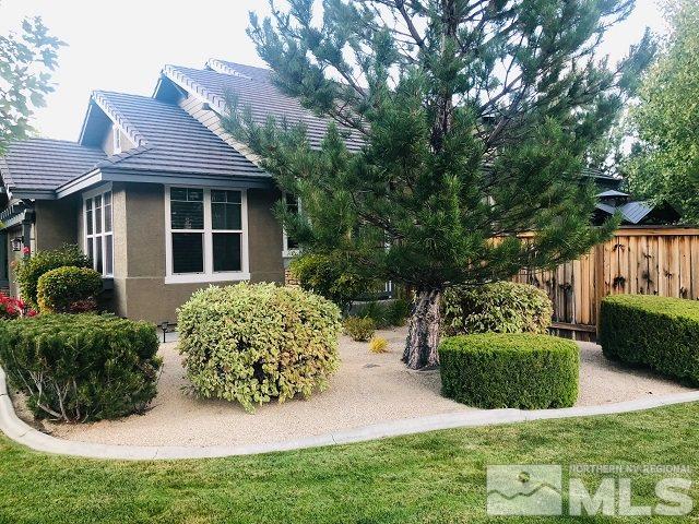 5001 Fall Colors Court Reno, NV 89519 - Photo 5 of 36 a front view of a house with a garden